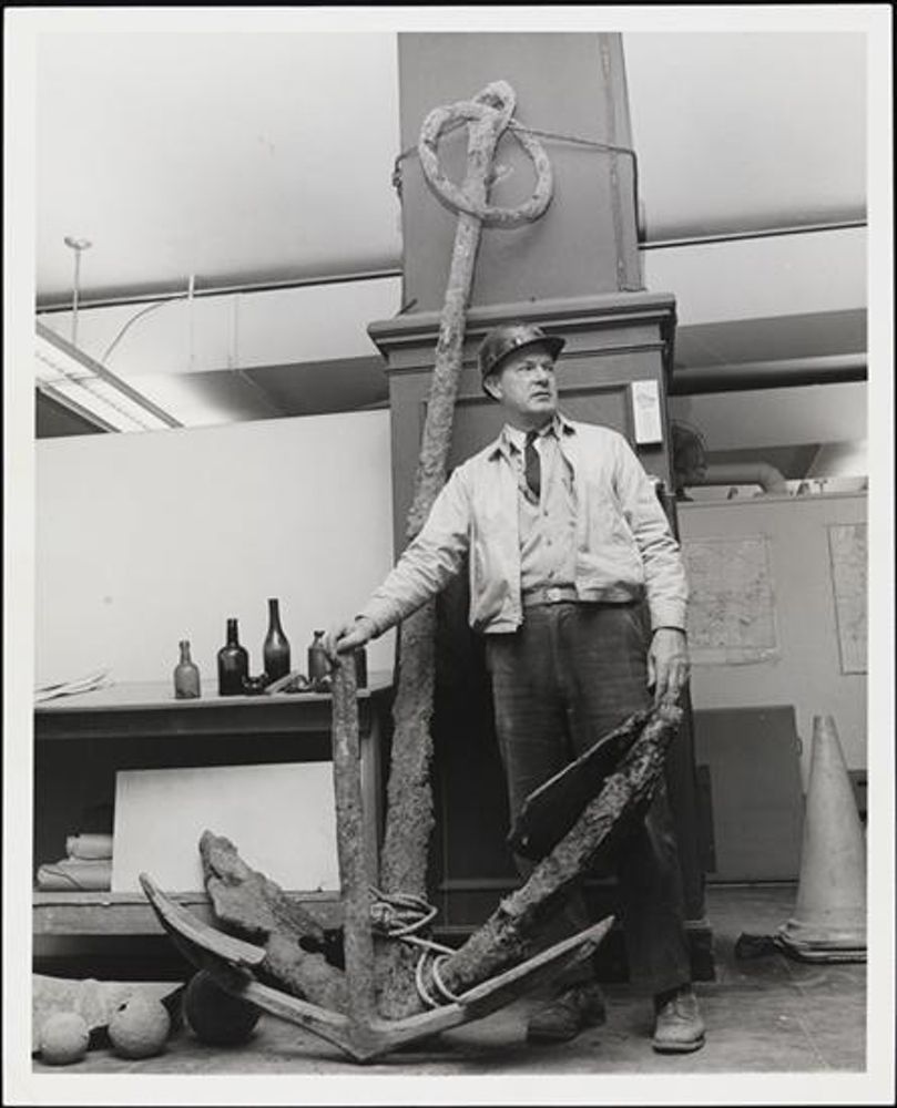 Henry Druding, the Senior Resident Engineer of World Trade Center, with objects found at site. 1968. (Photo courtesy of <a href="http://collections.mcny.org/">the MCNY</a>)
